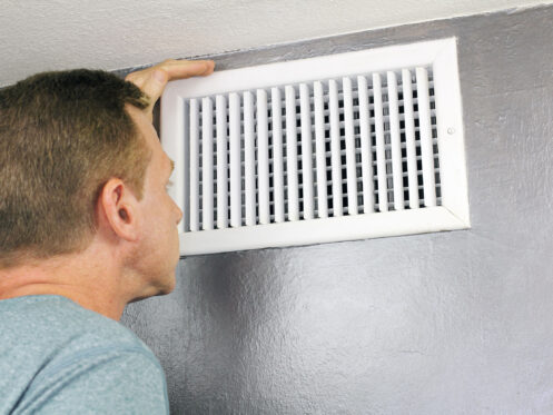 Homeowner looking into vent, AC not blowing air